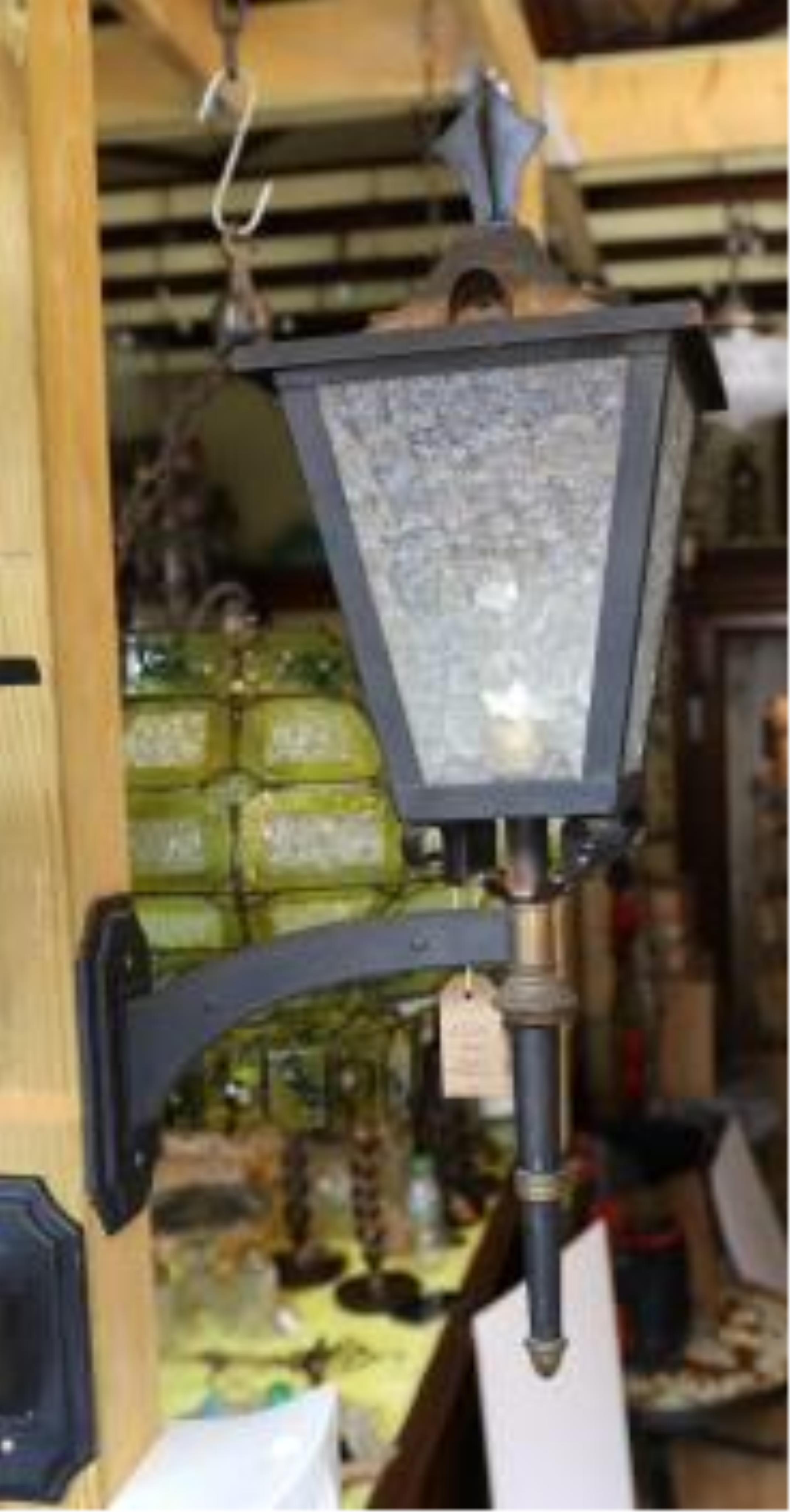 A pair of 1960s French brass mounted wrought iron carriage lanterns, height 64cm. depth 34cm. Condition - fair